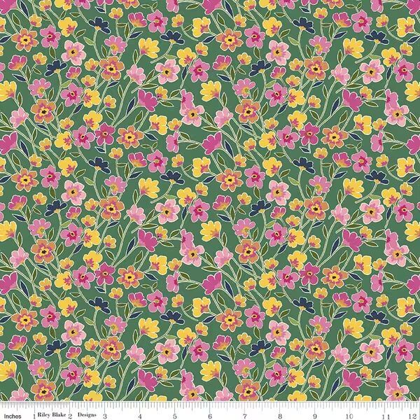 Floral fabric pattern with pink, yellow, and purple flowers on a green background.