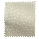 Fabric swatch with a beige background and white polka dots