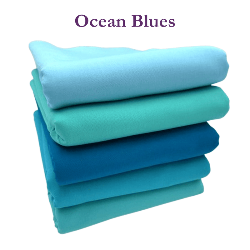 Stack of blue fabrics with 'Ocean Blues' text on a white background
