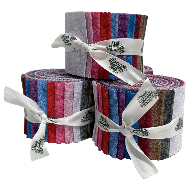 Set of fabric rolls with a white ribbon and 'The Fabric Company' label on a white background