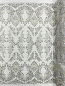 Damask Wing Design Embroidered Heavy Beaded Lace on 54" Mesh Fabric.